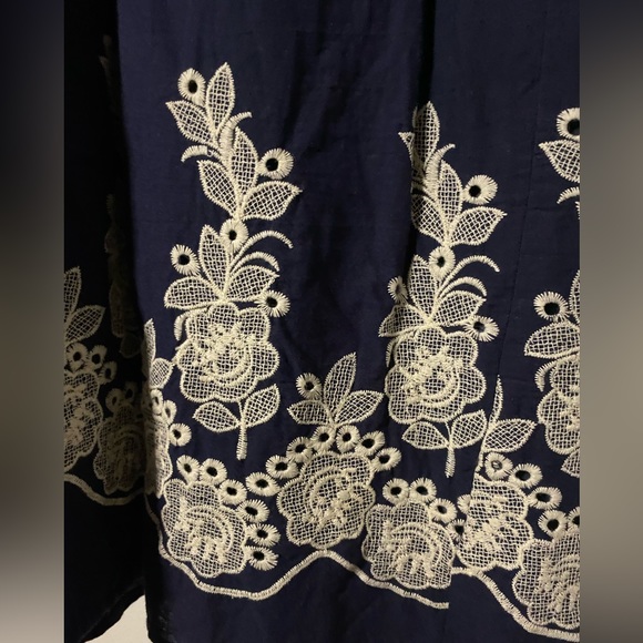 Navy blue V-neck, empire waist dress with floral-embroidered detail at bottom - Picture 3 of 5